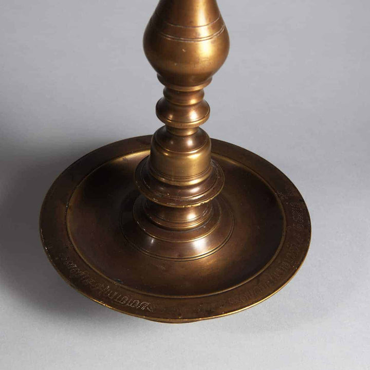 Close-up of brass base detail for Matched Pair of Turned Brass Indian Table Lamps from 19th century India.
