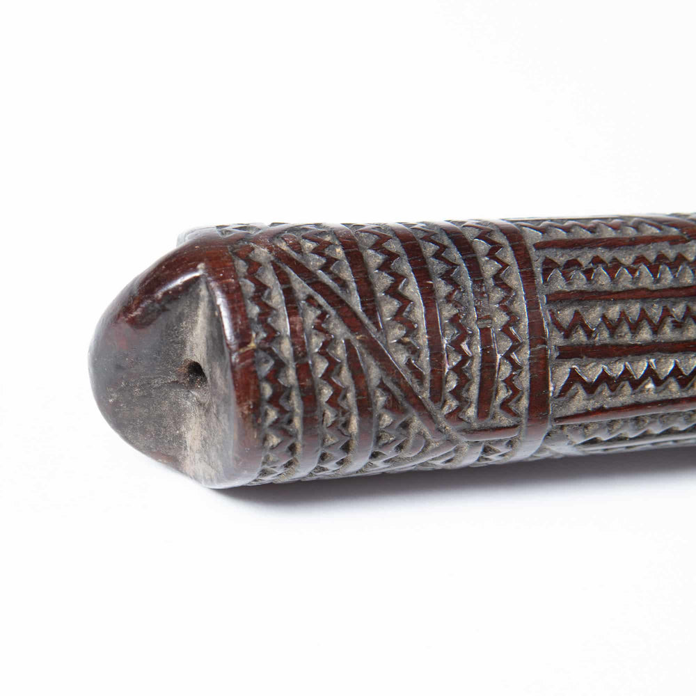 Close-up of a carved 19th-century Tongan ironwood war club handle from Collection ON10 showing detailed geometric patterns