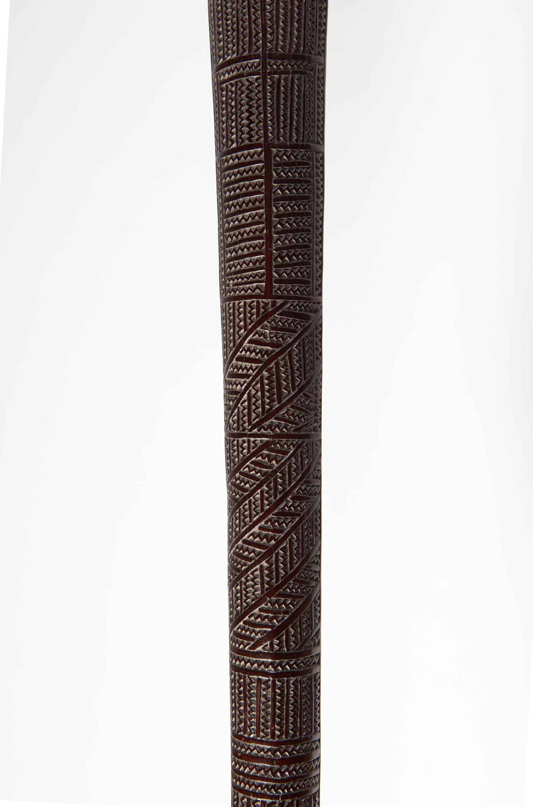 Close-up of a carved 19th century Tongan ironwood war club from Collection ON10 showcasing intricate geometric patterns
