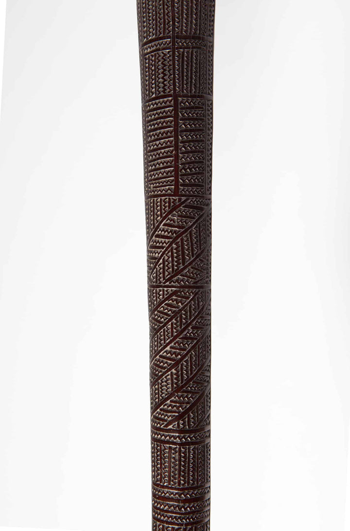 Close-up of a carved 19th century Tongan ironwood war club from Collection ON10 showcasing intricate geometric patterns