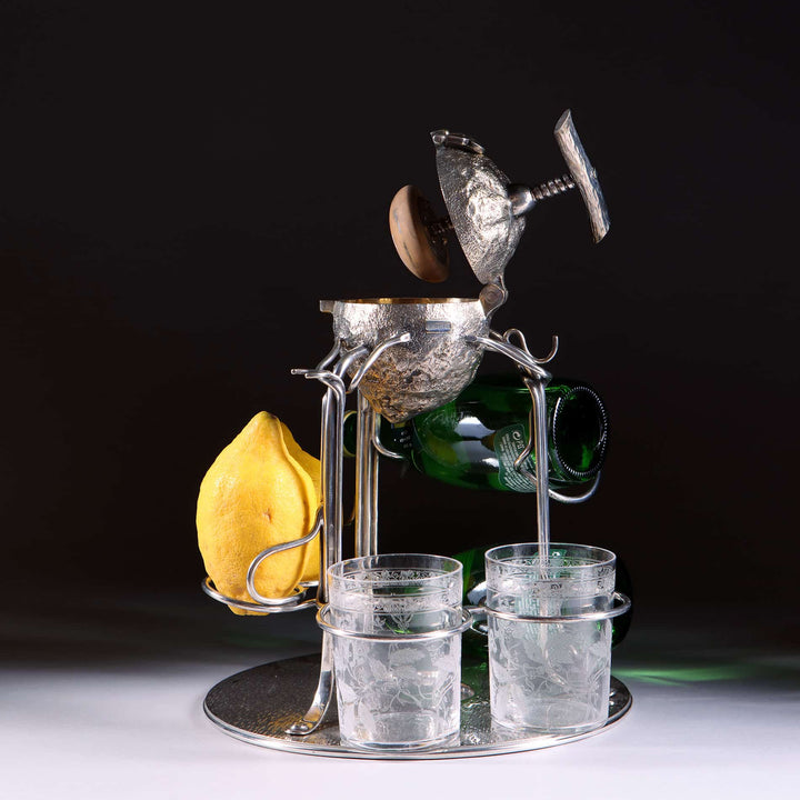 Hukin Heath silver plate and gilt lemon squeezer on stand with glasses and lemon by The Sold Archive