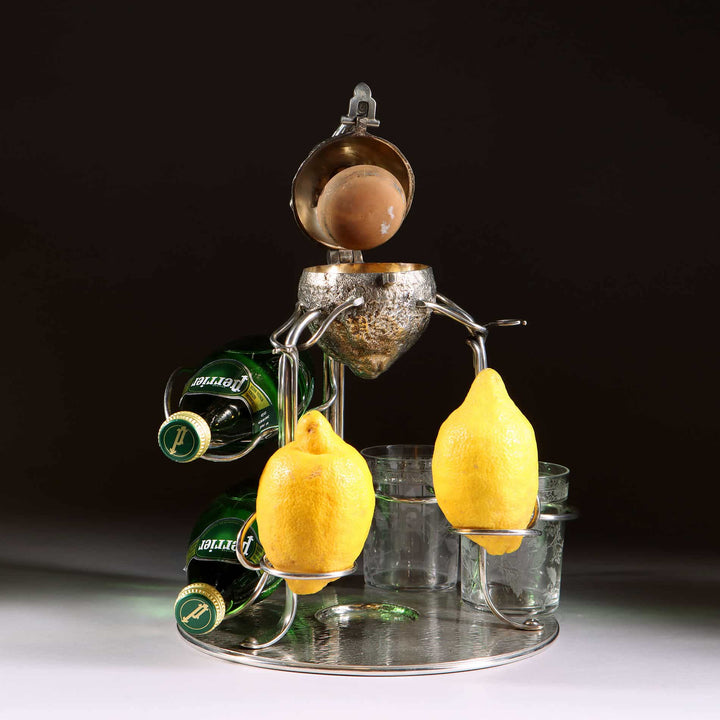 Hukin and Heath silver plate and gilt lemon squeezer with bottle holders by The Sold Archive on silvered dish stand