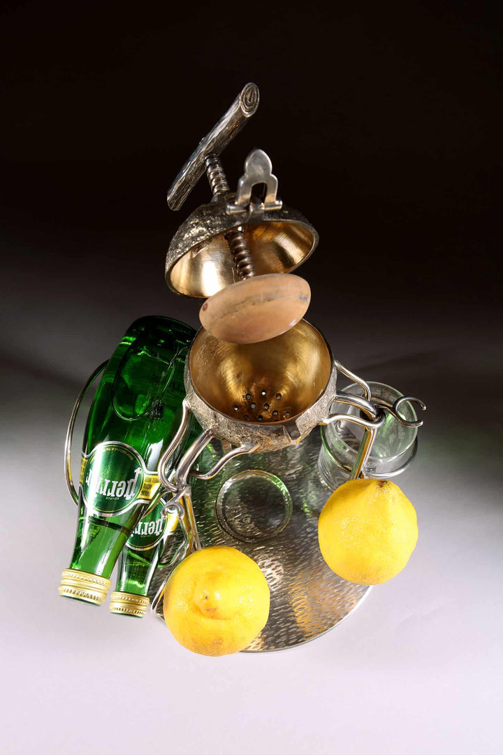 Hukin and Heath silver plate and gilt lemon squeezer with tray and lemons by The Sold Archive