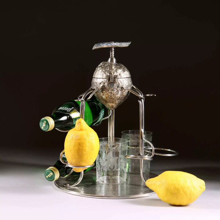 Hukin and Heath silver plate lemon squeezer with bottles and glasses on silvered dish stand by The Sold Archive