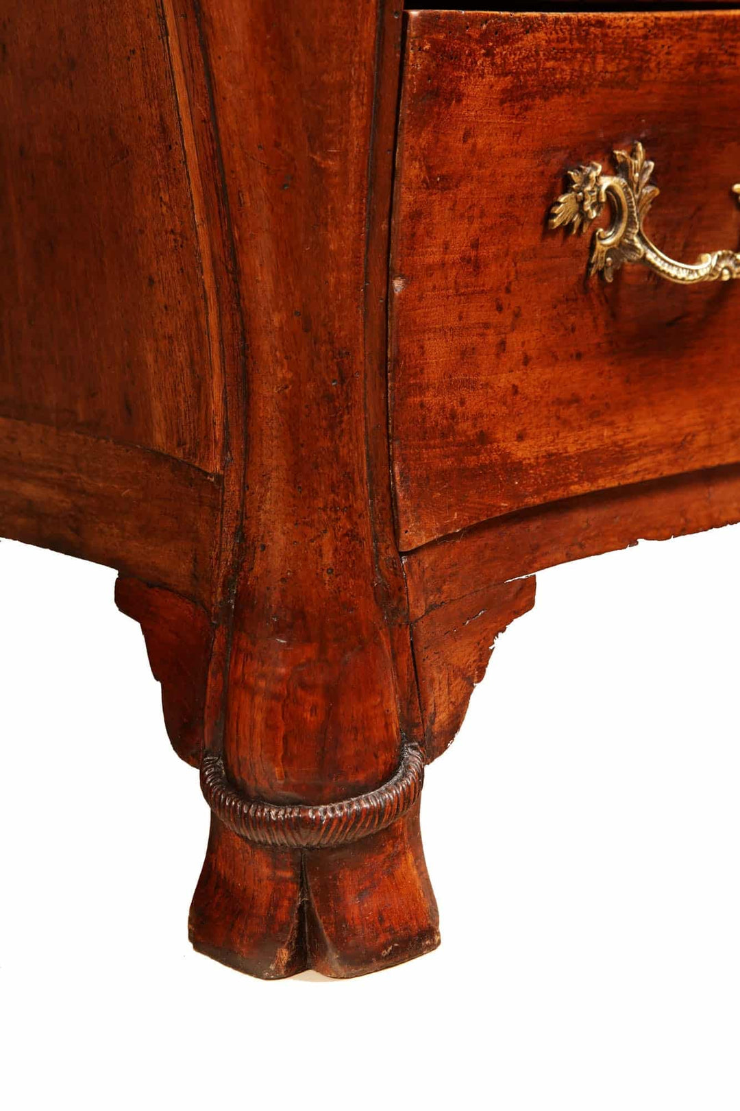 Close-up of carved hoof foot on mid 18th century French walnut commode by Nwtiques