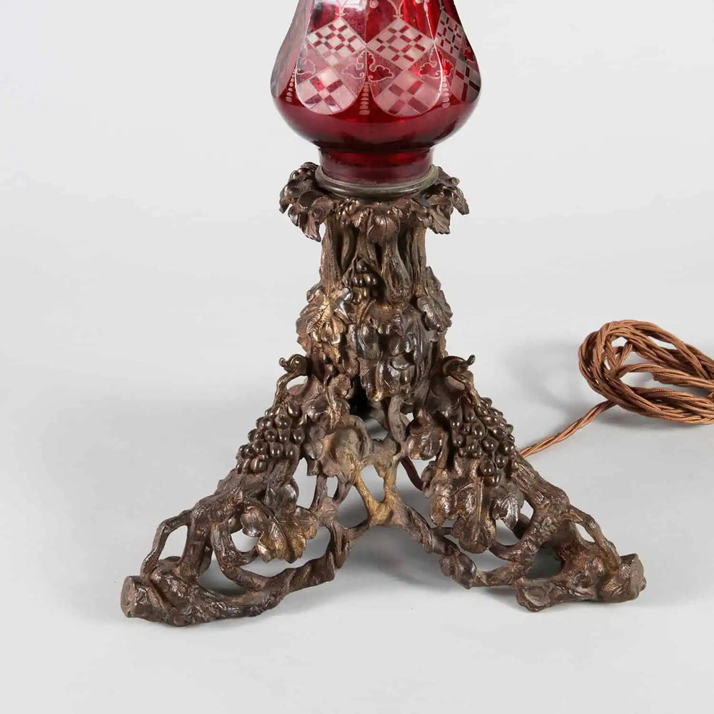 Large Bohemian Engraved Red Glass Table Lamp with ornate cast brass base featuring vine and grape details.