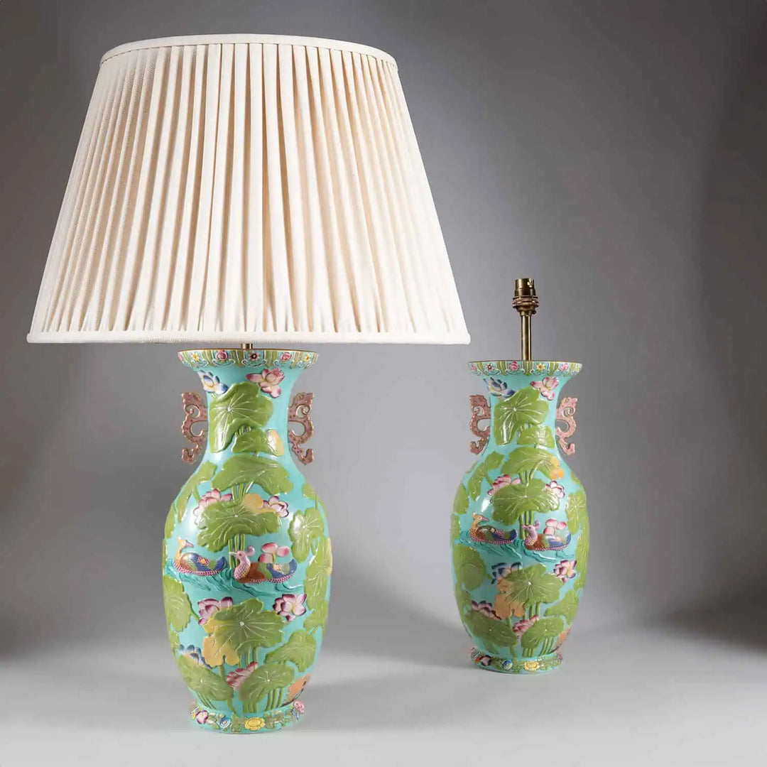 Pair of Staffordshire Vases Mounted as Table Lamps in turquoise porcelain with floral and bird designs and pink dragon handles.