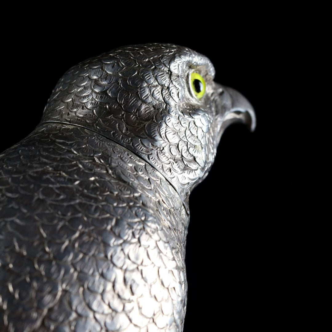 Close-up of a German early 20th century solid silver hawk sculpture with yellow glass eyes by Collection CK20