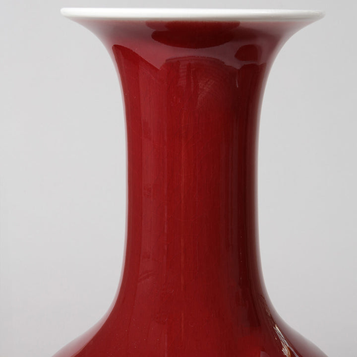Pair of Sang de Boeuf Bottle Vases as Table Lamps with deep red glaze and elegant flared tops.