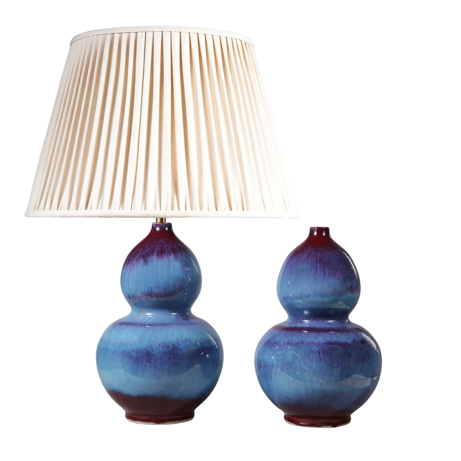 Pair of Flambe Double Gourd Vases as Table Lamps in blue and purple glaze with one featuring a white pleated lampshade.