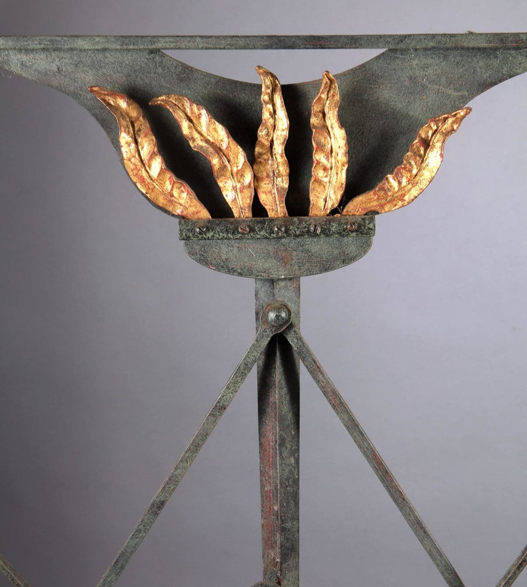 Close-up of decorative window grille with gilt leaves in wrought iron by Mark Brazier Jones Collection CK10