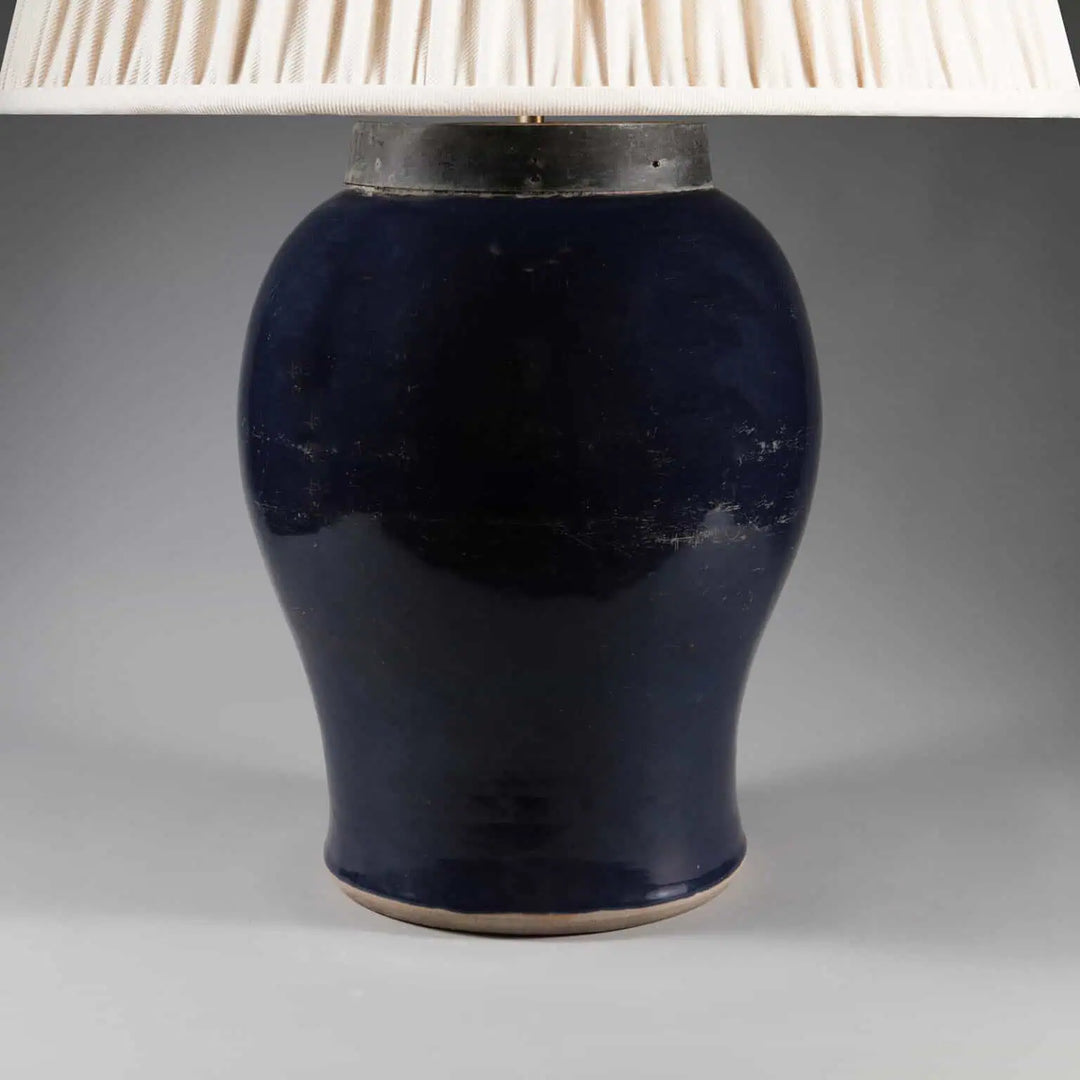 Chinese Monochrome Blue Table Lamp featuring a 19th century bulbous blue vase with metal collar and fabric shade.