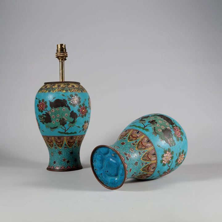 Pair of Chinese Cloissoné Lamps with foo dogs on blue ground and floral details, circa 1870, 27.5 cm height.