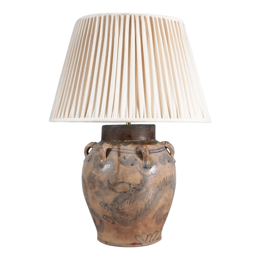 17th Century South China Sea Pottery Table Lamp with blue dragon design and copper collar, pleated cream lampshade.