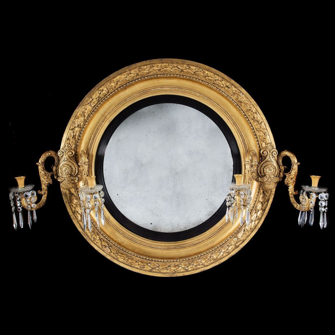 Monumental over scale Regency convex giltwood mirror with carved acanthus candelabra by The Sold Archive