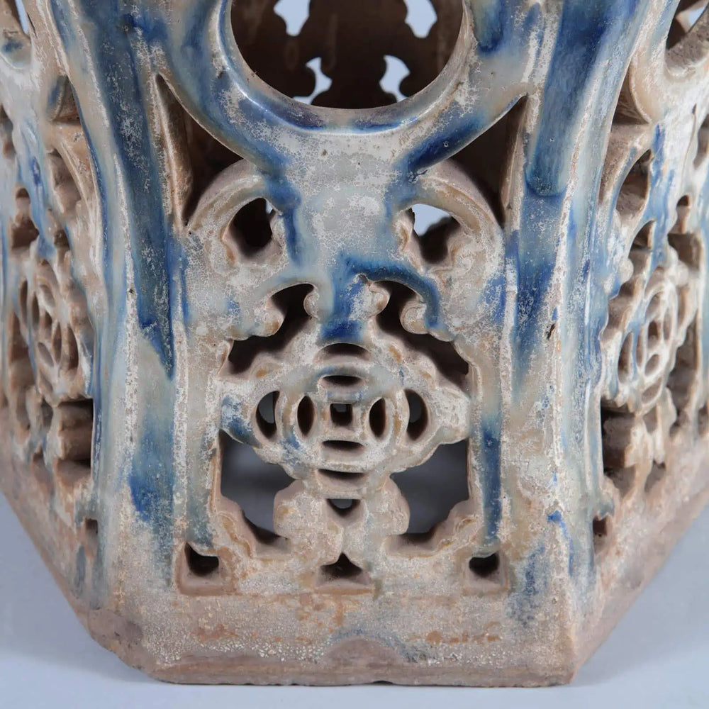 Close-up of antique Chinese pottery drip glazed stool with ornate openwork in blue and beige by Collection EE30