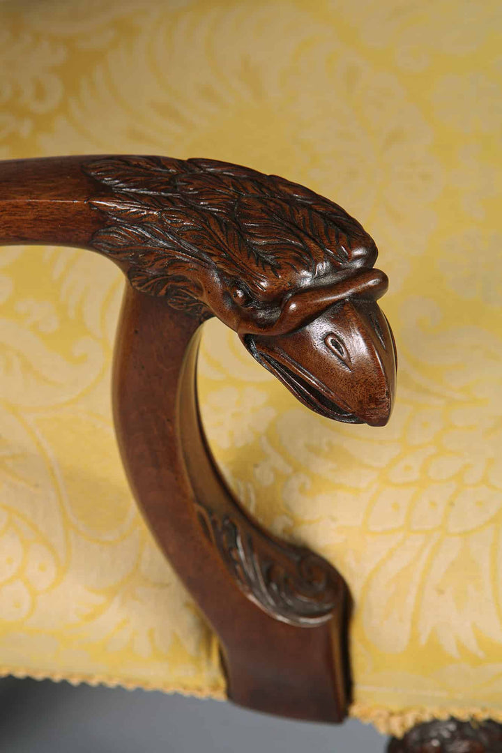 Close-up of carved walnut eagle head armrest on George I style armchair by Collection CK20