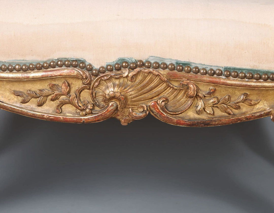 Close-up of gilt beech frame with shell and foliate carving on a Napoleon III Rococo window seat by Collection CK20