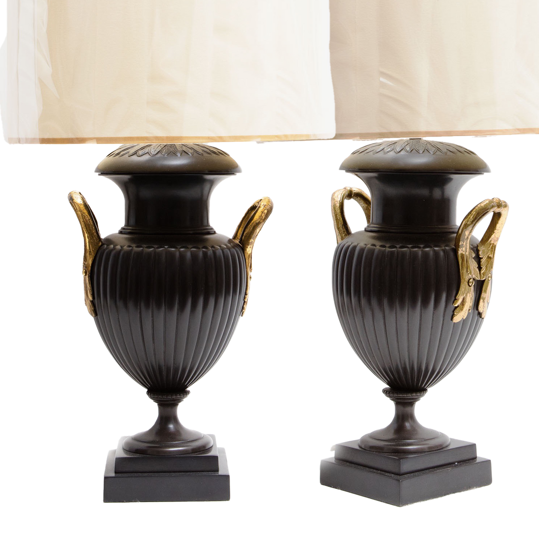 Pair of Neo-Classical Bronze Urn Lamps with leaf decoration and lacquered brass handles, circa 1970, England, 29 inches tall.