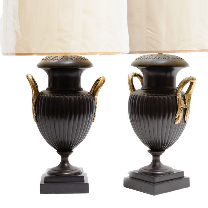 Pair of Neo-Classical Bronze Urn Lamps with leaf decoration and lacquered brass handles, circa 1970, England, 29 inches tall.