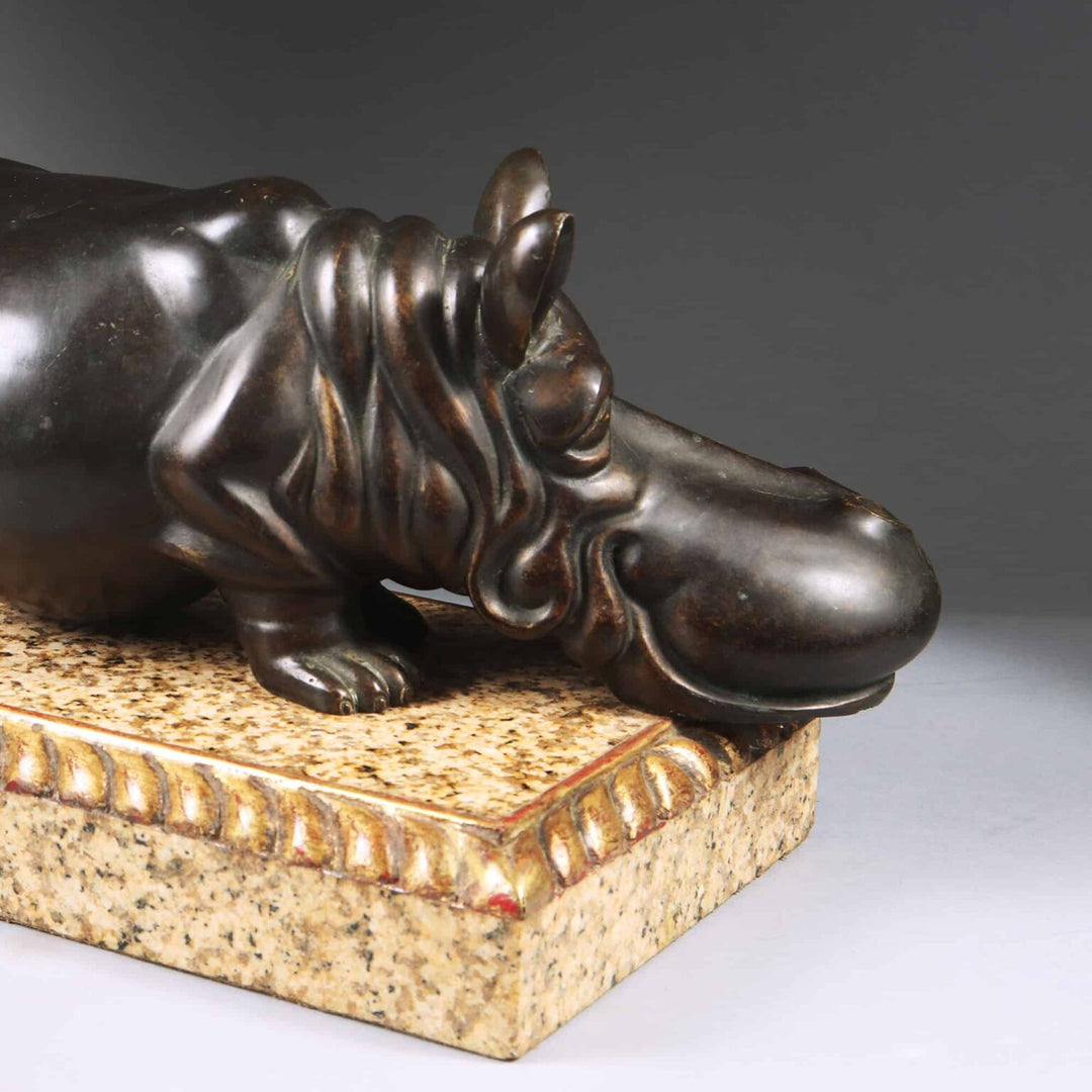 Bronze Hippo Antique Sculpture on a marble base with carved giltwood gadrooned edges, circa 1900 European design.