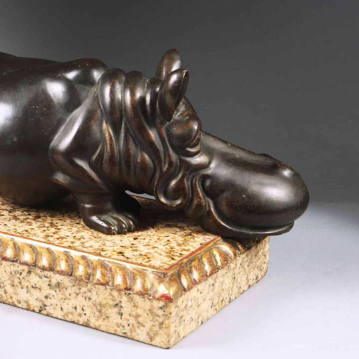 Bronze Hippo Antique Sculpture on a marble base with carved giltwood gadrooned edges, circa 1900 European design.