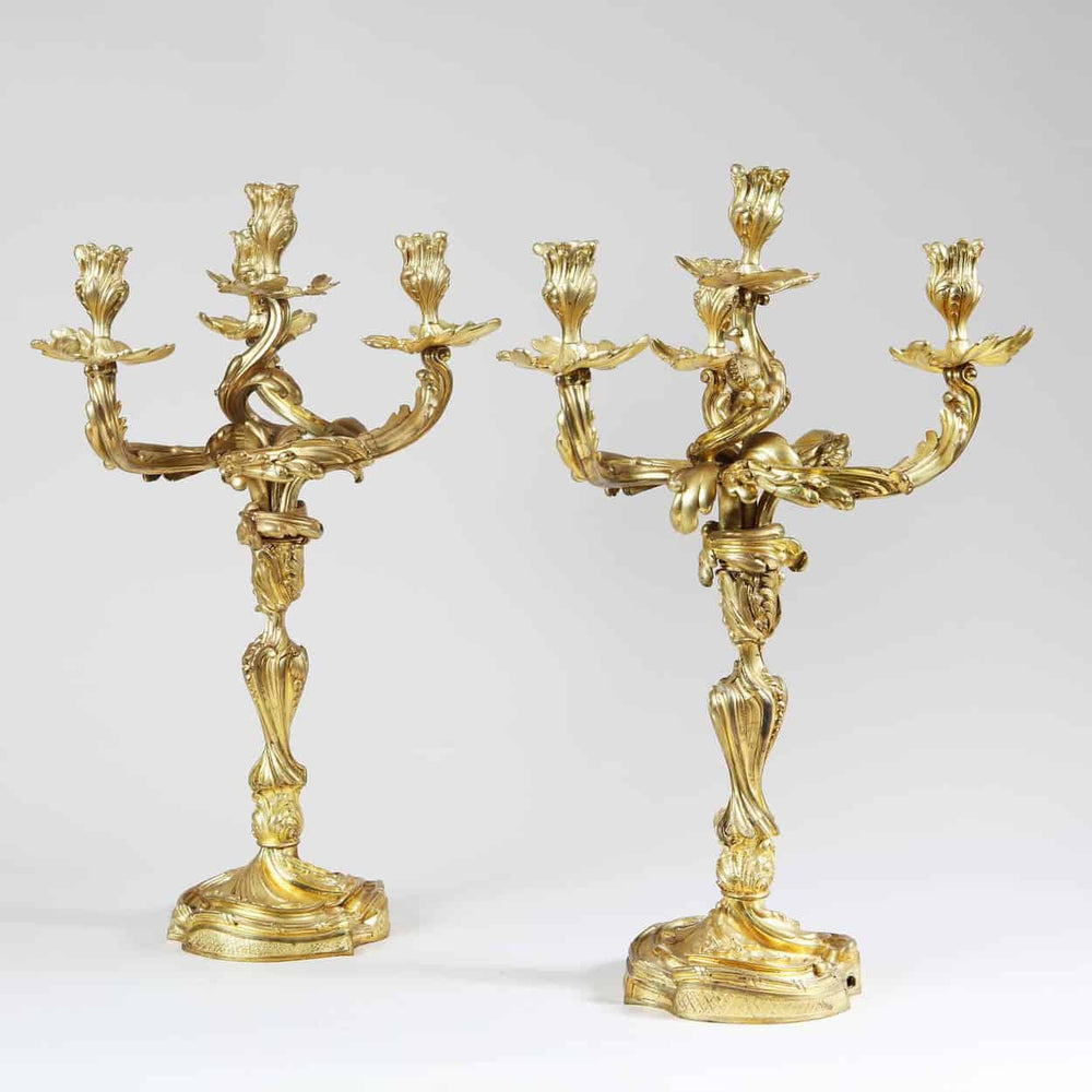 Pair of ornate Louis XV style four-light ormolu candelabra by Collection NI10 with intricate baroque detailing