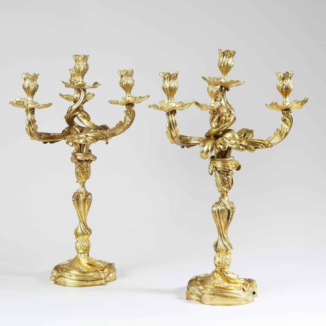 Pair of ornate Louis XV style four-light ormolu candelabra by Collection NI10 with intricate baroque detailing