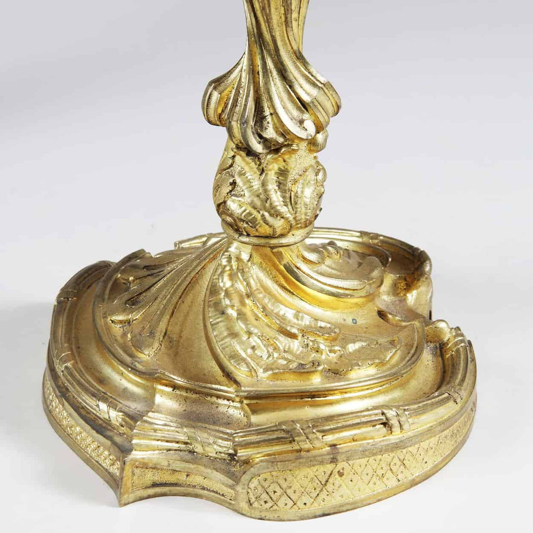 Close-up of gold ormolu base on Louis XV style four-light candelabra from Collection NI10 with intricate detailing