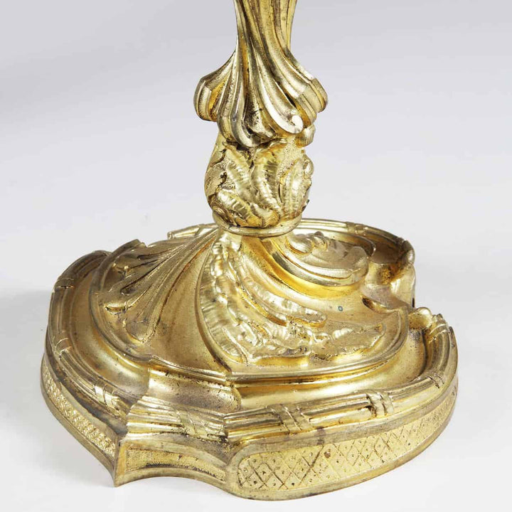 Close-up of gold ormolu base on Louis XV style four-light candelabra from Collection NI10 with intricate detailing
