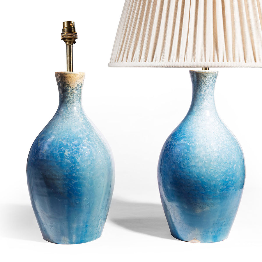 Pair of blue crystalline glaze ceramic table lamps by Nwtiques with elegant baluster shapes and creamy shades