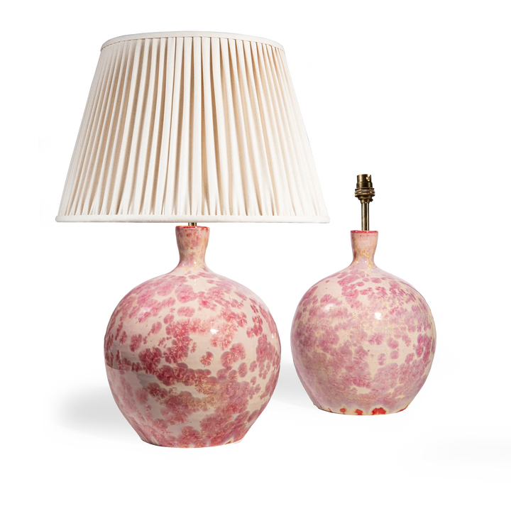 Pair of pink crystalline glazed spherical vase lamps by Nwtiques with pleated ivory lamp shade