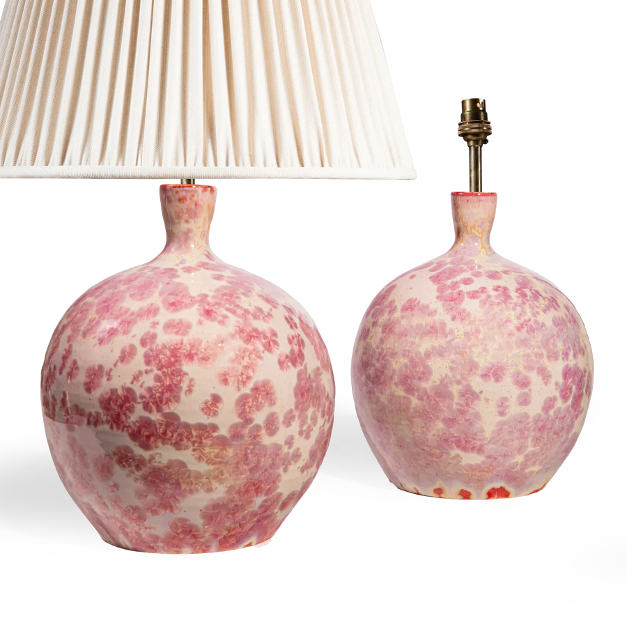 Pair of pink crystalline glazed spherical vase lamps by Nwtiques with soft ivory background and rose-pink blooms