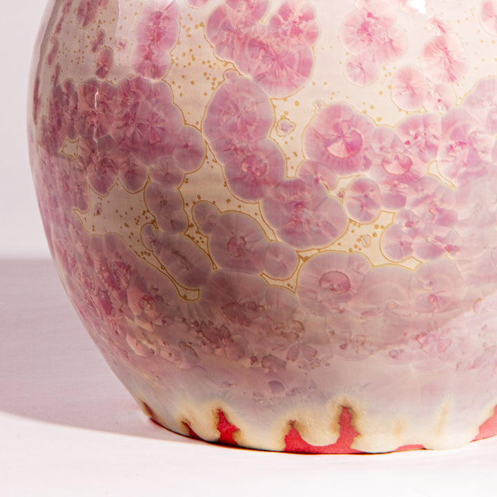 Close-up of a pink crystalline glazed ceramic vase lamp by Nwtiques showing detailed bloom patterns