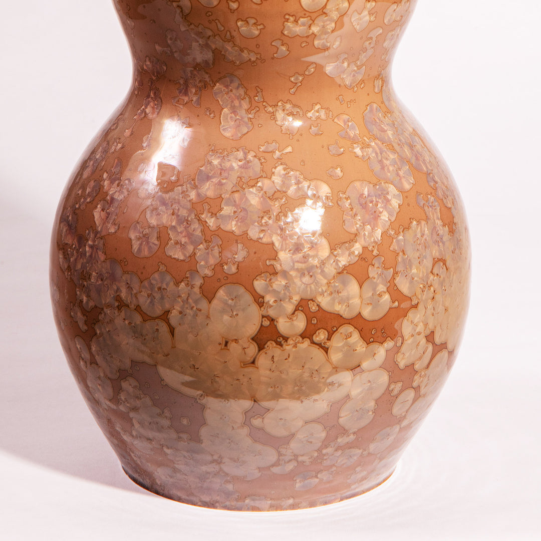 Close-up of a warm caramel and ivory crystalline glazed gourd-shaped lamp from Nwtiques