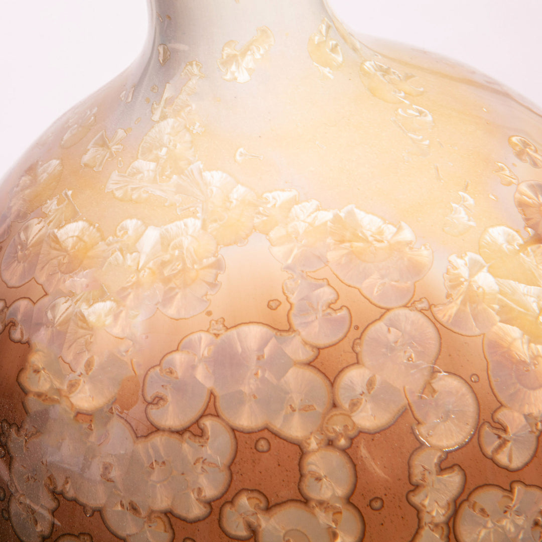 Close-up of caramel and ivory crystalline glaze on a gourd-shaped ceramic lamp by Nwtiques