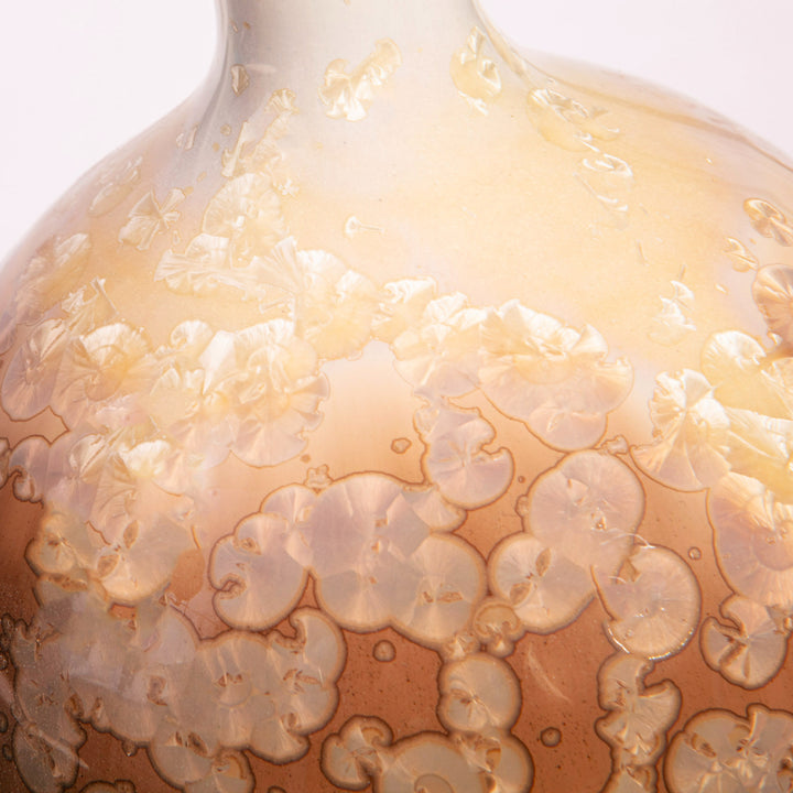 Close-up of caramel and ivory crystalline glaze on a gourd-shaped ceramic lamp by Nwtiques
