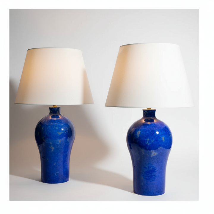 Pair of blue crystalline glazed vase lamps with white shades by Nwtiques in elegant ceramic design