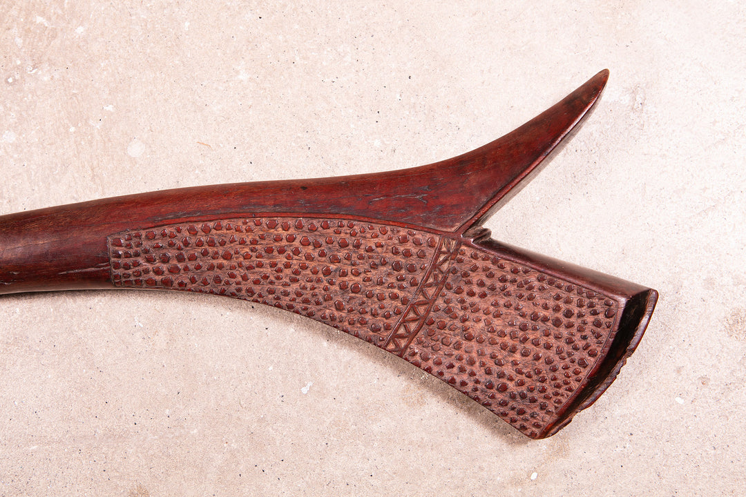 Carved Fijian Gata war club by Collection ON20, crafted from dense hardwood with detailed texture and tribal design.