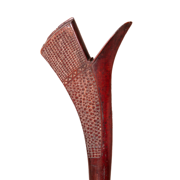 Detail of a carved Fijian Gata war club in dark hardwood from Collection ON20, showcasing intricate traditional patterns.