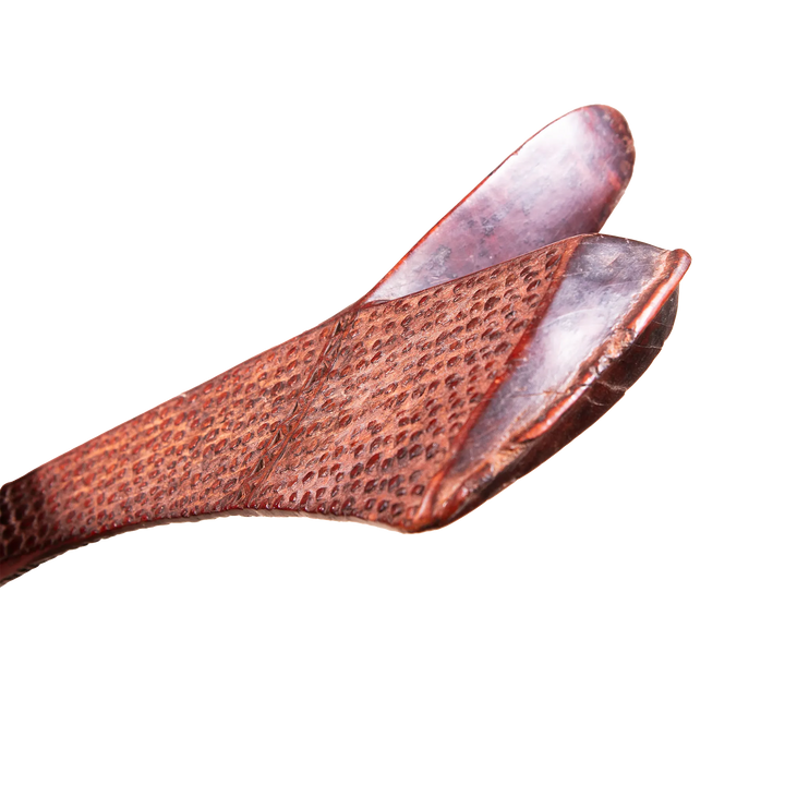 Close-up of a carved hardwood Fijian Gata war club tip, showcasing intricate texture by Collection ON20.