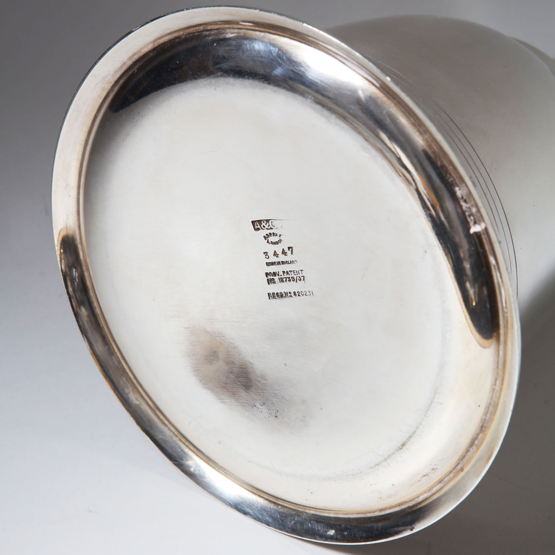 Bottom view of Asprey Bell Shaped Cocktail Shaker with maker's mark from Collection TH10 on silver surface