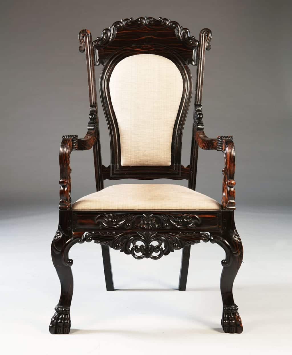 Antique Sinhalese Calamander wood armchair with carved claw feet and upholstered seat by Nwtiques