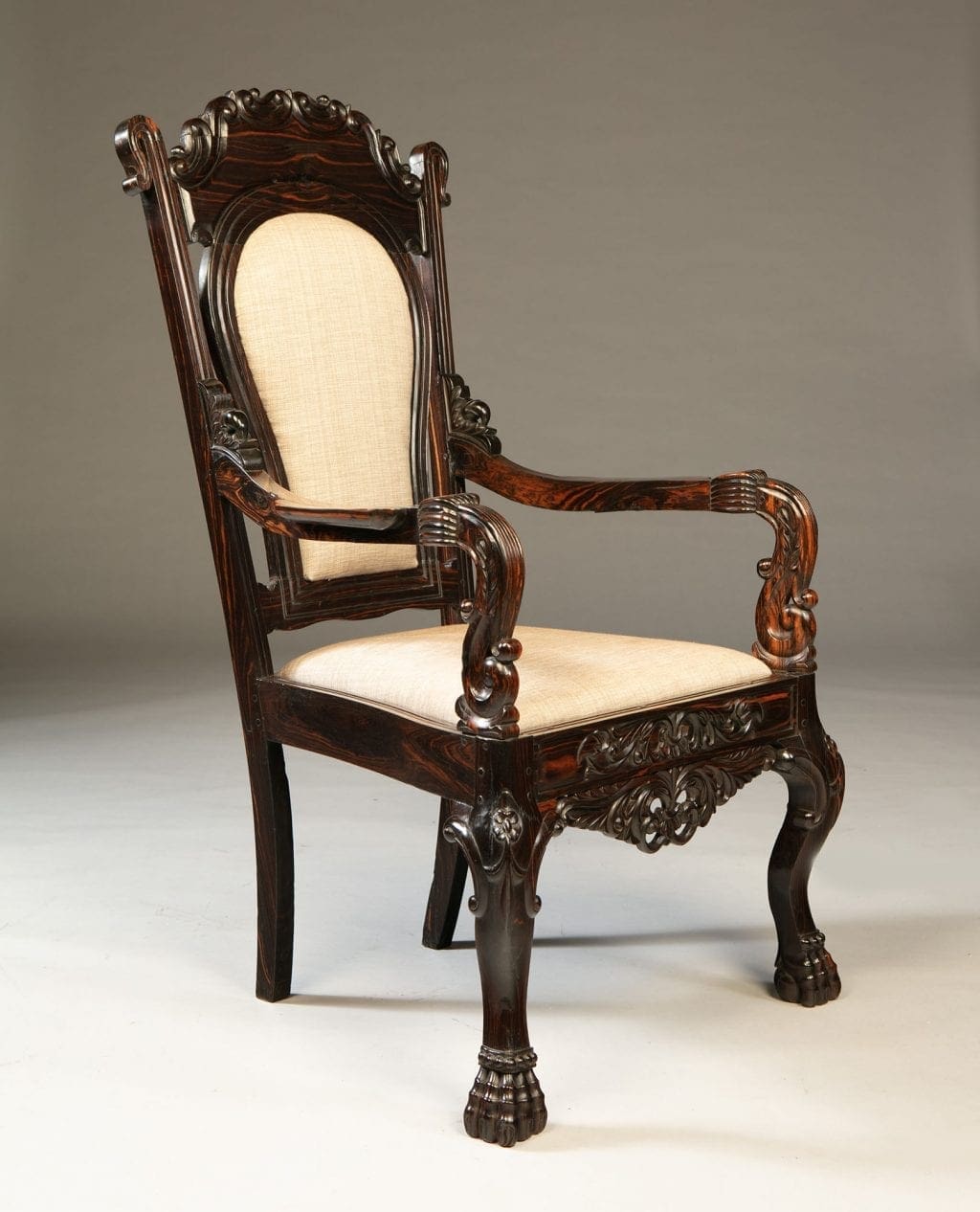 Single 19th century Sinhalese calamander wood armchair with carved details by Nwtiques