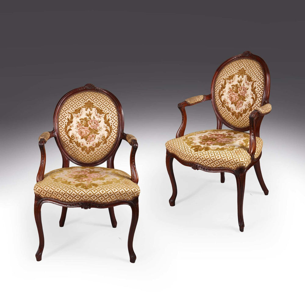 Pair of George III mahogany armchairs with floral upholstery by Nwtiques in elegant classic design