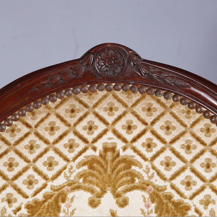Close-up of carved mahogany backrest and patterned upholstery on George III armchair by Nwtiques