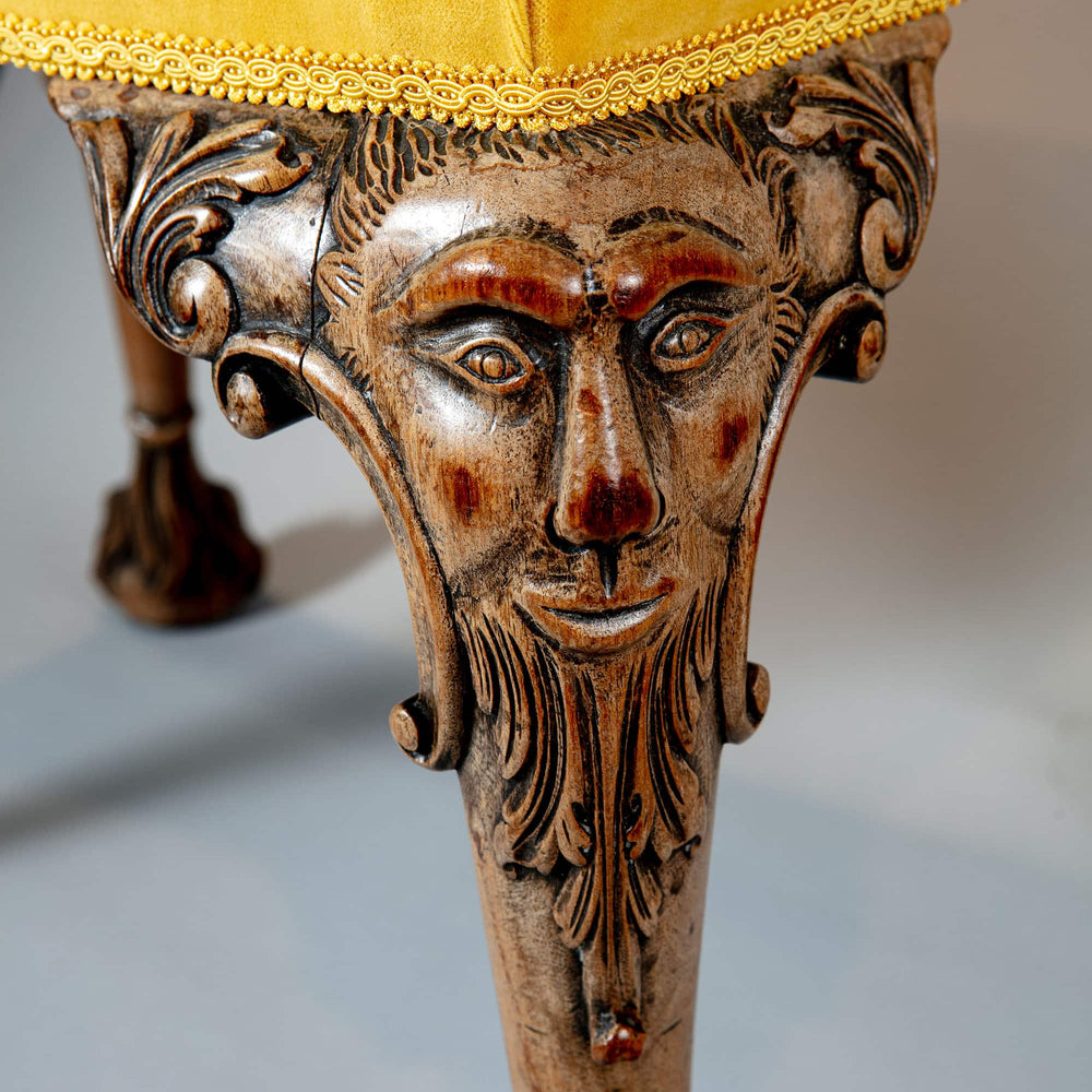 Intricately carved George II style stool leg with Green Man motif in faded walnut from Collection CK20.
