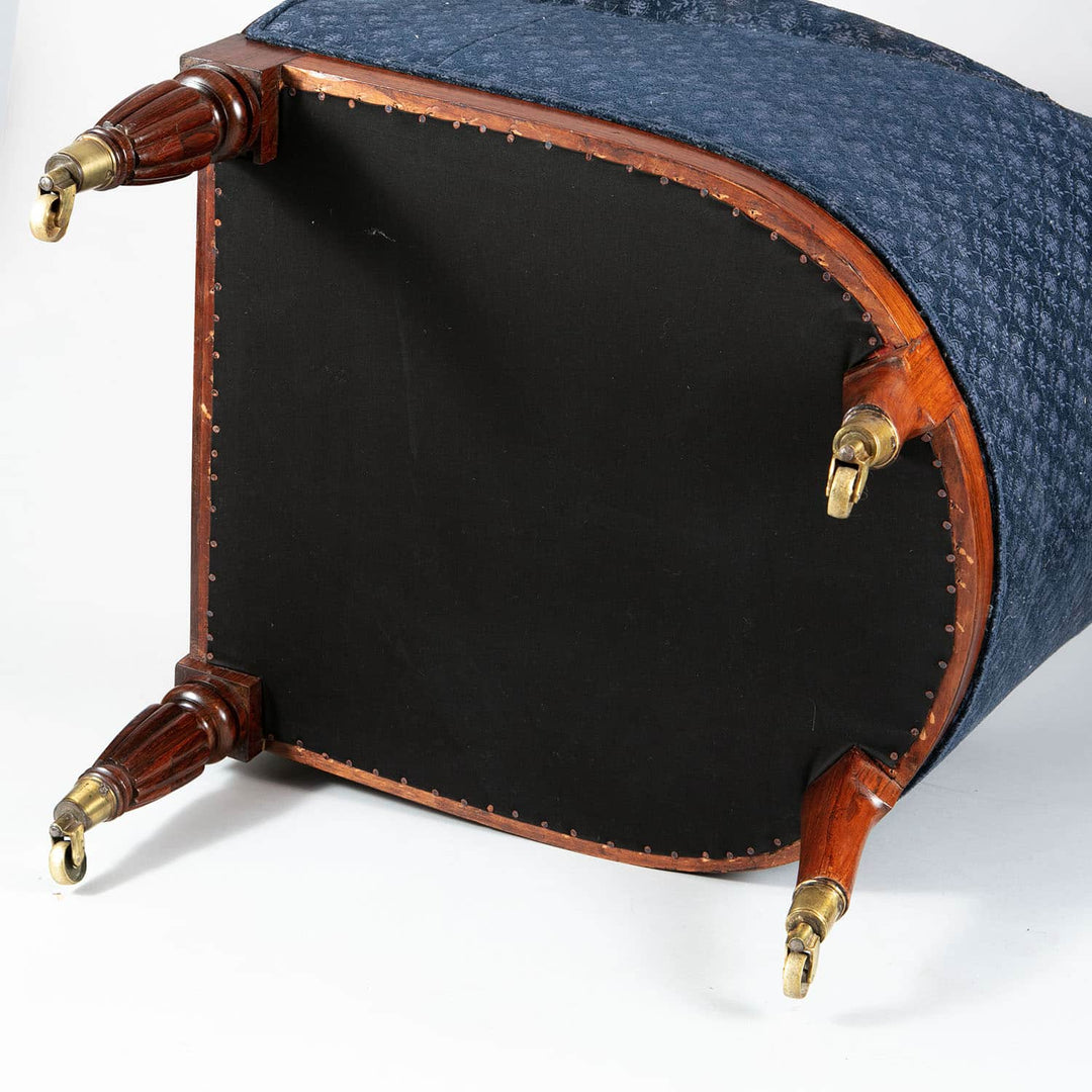 Underside view of a Regency lyre form rosewood library chair with brass castors from Collection CK20