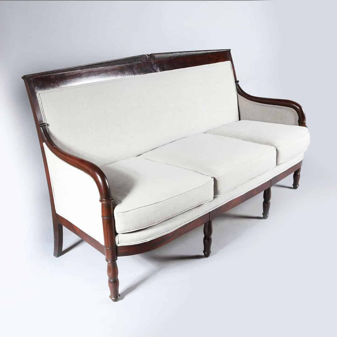 Early 19th century French Empire mahogany sofa with white upholstery by Collection TH20 in elegant neoclassical style
