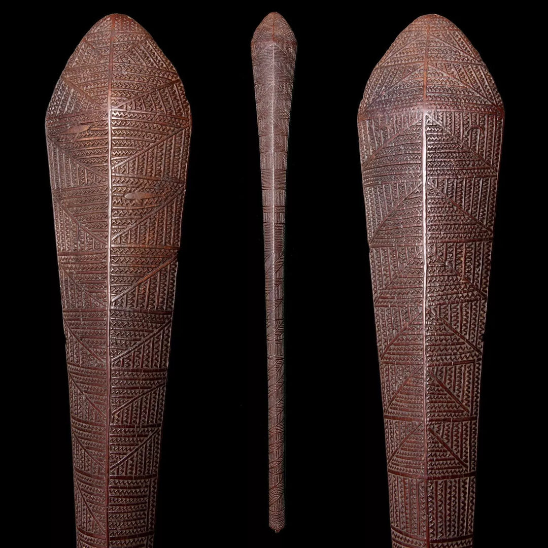 An exceptional 19th century Tongan ironwood war club with intricate carvings from Collection ON10 displayed on black background